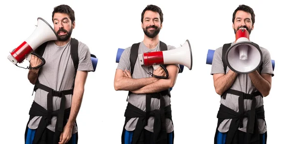 Set of Happy Handsome backpacker holding a megaphone — Stock Photo, Image