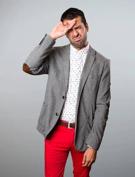 Handsome man with fever on grey background