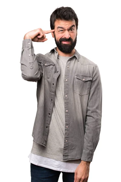 Bonito homem com barba fazendo gesto louco no fundo branco — Fotografia de Stock