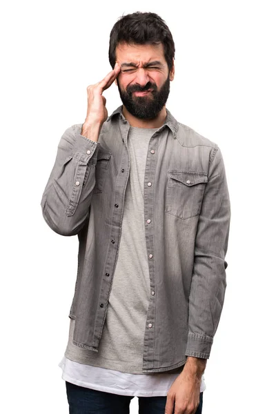 Frustrierter schöner Mann mit Bart auf weißem Hintergrund — Stockfoto
