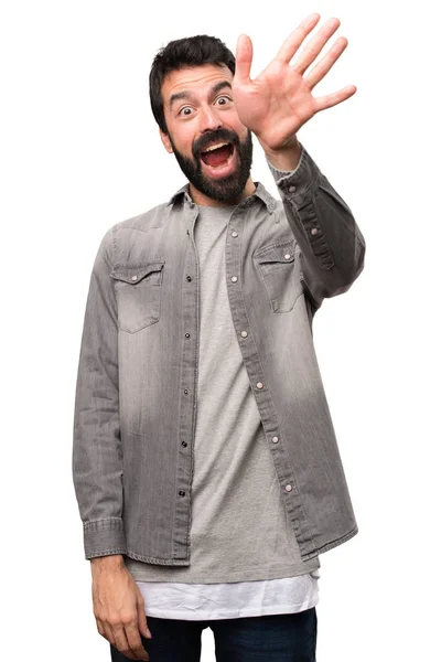 Hombre guapo con barba saludando sobre fondo blanco — Foto de Stock