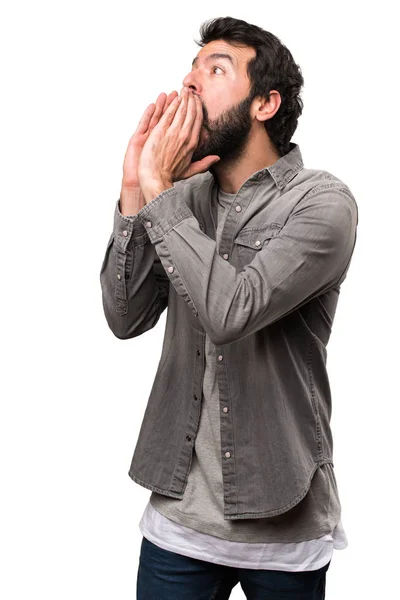 Handsome man with beard shouting on white background — Stock Photo, Image