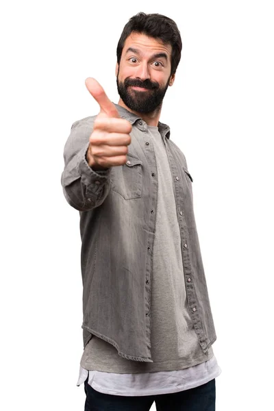 Hombre guapo con barba con el pulgar hacia arriba sobre fondo blanco — Foto de Stock