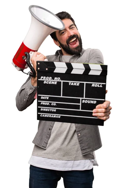 Handsome man with beard with cinema items on white background — Stock Photo, Image