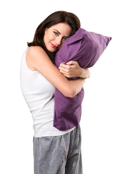 Felice bella ragazza con un cuscino — Foto Stock
