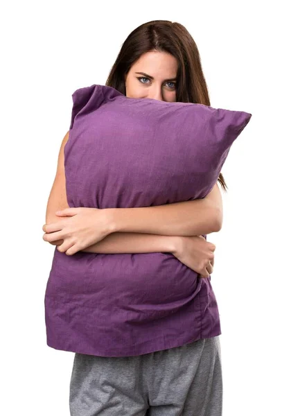Beautiful young girl with a pillow — Stock Photo, Image