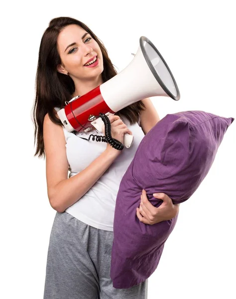 Menina bonita com um travesseiro segurando um megafone — Fotografia de Stock