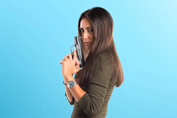 Woman holding a pistol — Stock Photo, Image