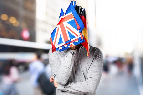 Man with holding many flags — Stock Photo, Image