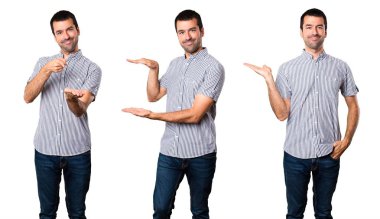 Yakışıklı adam bir şey tutan kümesi