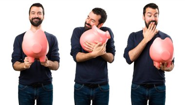 Bir servet tutan sakallı yakışıklı adam kümesi