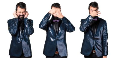 Yüzünü kaplayan payet ceket ile yakışıklı adam