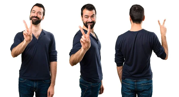 Conjunto de hombre guapo con barba contando dos —  Fotos de Stock