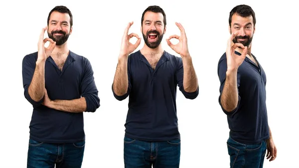 Conjunto de hombre guapo con barba haciendo signo OK —  Fotos de Stock