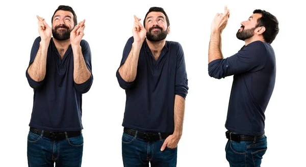 Conjunto de homem bonito com barba com os dedos cruzando — Fotografia de Stock