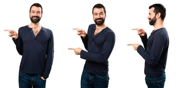 Set of Handsome man with beard pointing to the lateral — Stock Photo, Image
