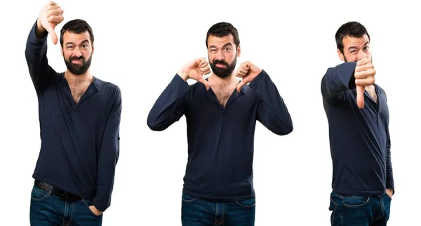 Conjunto de hombre guapo con barba haciendo mala señal — Foto de Stock