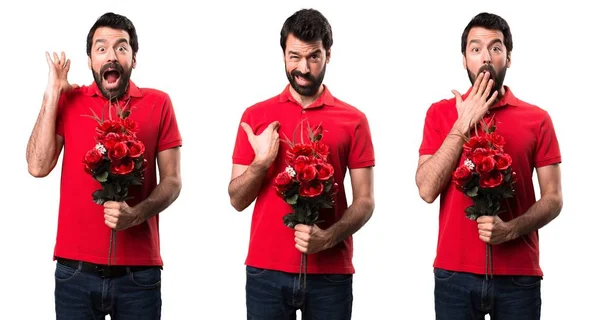 Conjunto de hombre guapo cansado sosteniendo flores —  Fotos de Stock