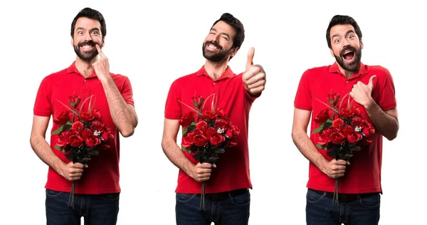 Conjunto de hombre guapo sosteniendo flores con el pulgar hacia arriba —  Fotos de Stock