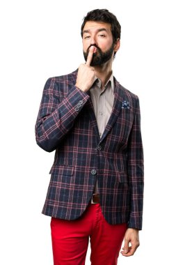 İyi giyimli adam yapma boynuz jest beyaz arka plan üzerinde