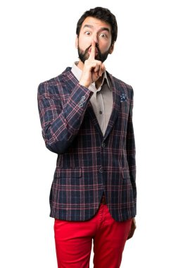 İyi giyimli adam yapma sessizlik jest beyaz arka plan üzerinde