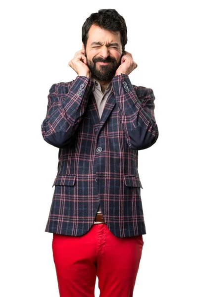 Well dressed man covering his ears on white background — Stock Photo, Image