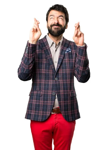 Hombre bien vestido con los dedos cruzando sobre fondo blanco — Foto de Stock