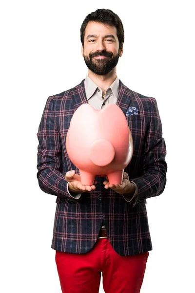 Feliz Bem vestido homem segurando um banco de pombo no fundo branco — Fotografia de Stock