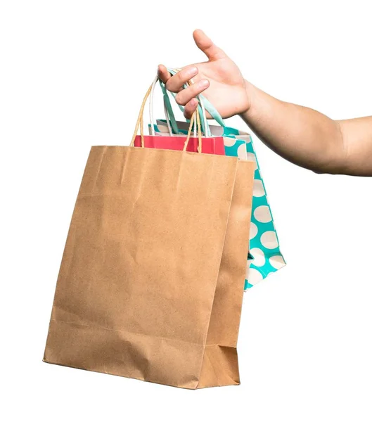 Hand holding Shopping bag over isolated white background — Stock Photo, Image