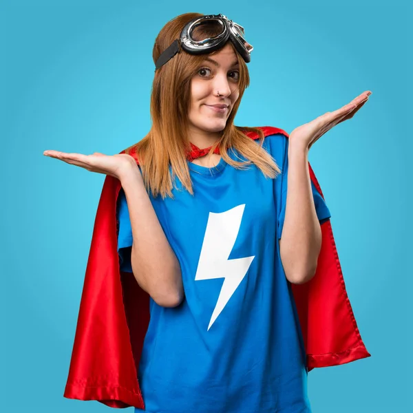 Pretty superhero girl making unimportant gesture on colorful bac