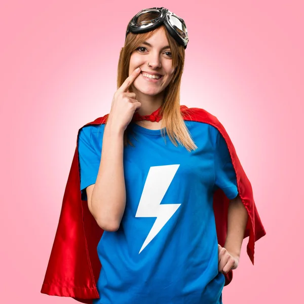 Happy pretty superhero girl on colorful background — Stock Photo, Image