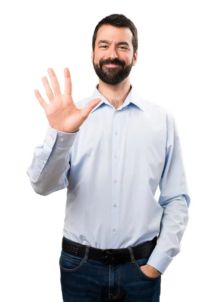 Handsome man with beard counting five — Stock Photo, Image