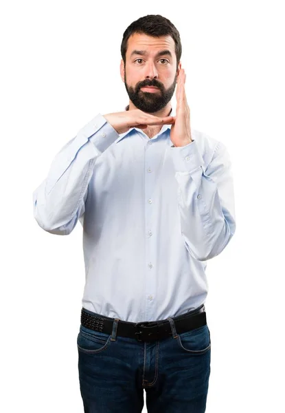 Hombre guapo con barba haciendo un gesto de tiempo fuera — Foto de Stock