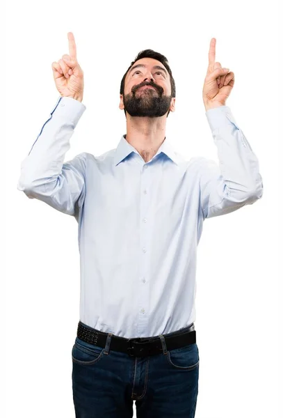 Handsome man with beard pointing up — Stock Photo, Image