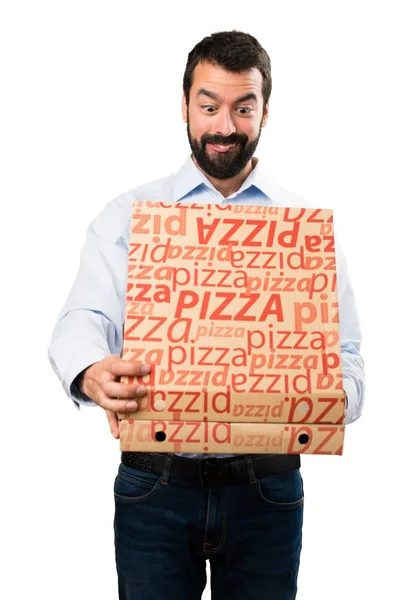 Pizza tutan sakallı yakışıklı adam — Stok fotoğraf