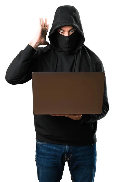 Hacker mit seinem Computer macht überraschende Geste auf isolierten whi — Stockfoto