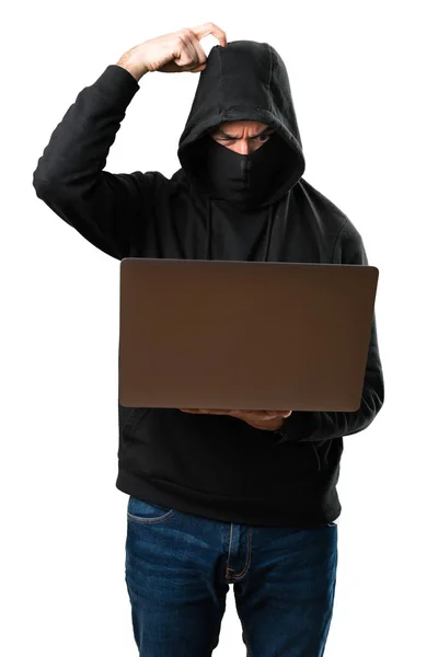 Hacker with his computer thinking on isolated white background — Stock Photo, Image