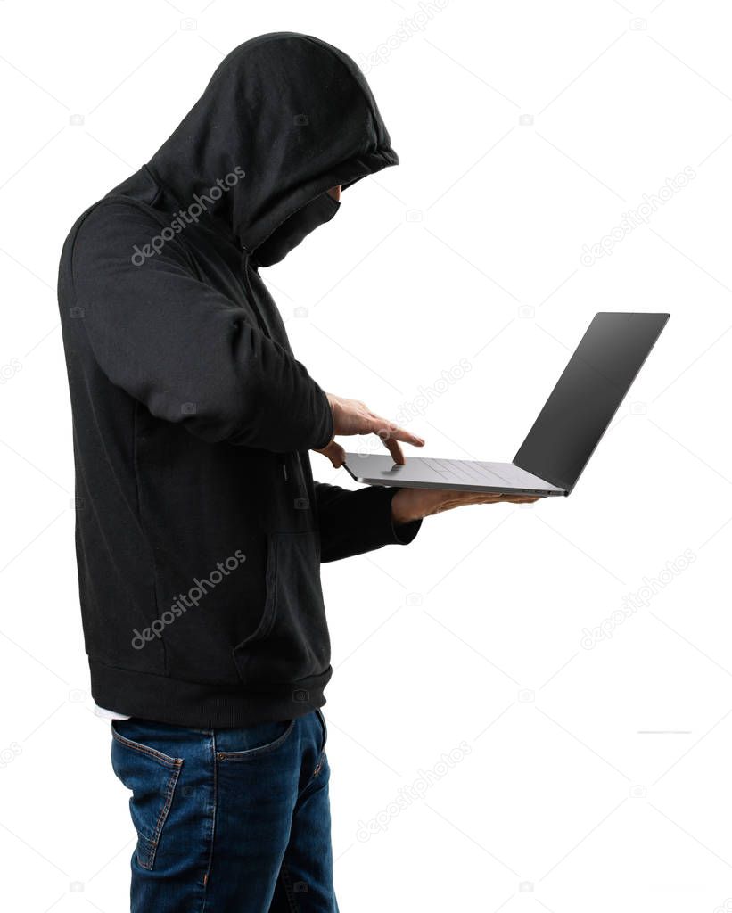 Hacker with his computer on isolated white background