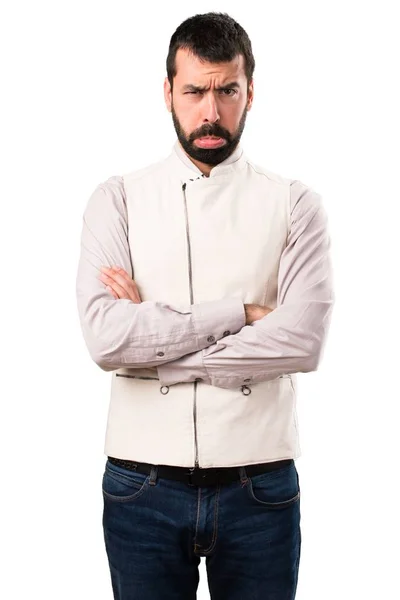 Triste bell'uomo con gilet su sfondo bianco isolato — Foto Stock