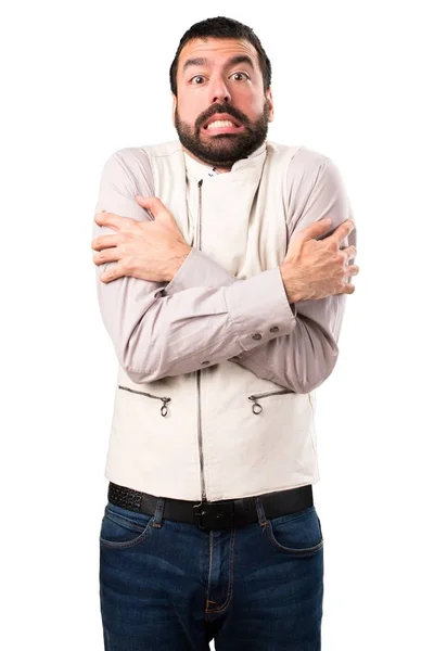 Knappe man met vest bevriezen op geïsoleerde witte achtergrond — Stockfoto
