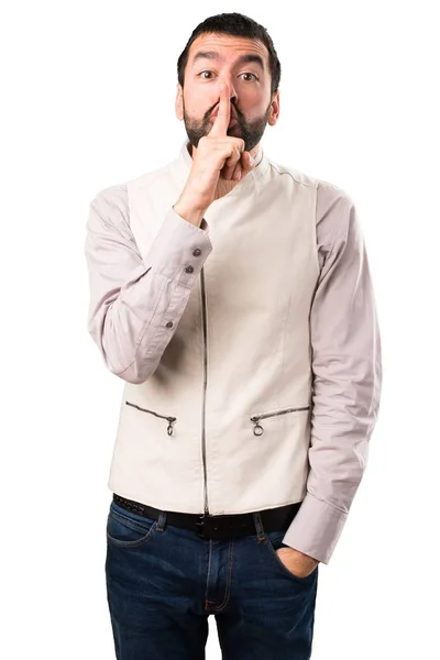 Knappe man met vest stilte gebaar maken op geïsoleerde witte achtergrond — Stockfoto