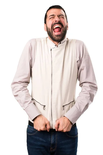 Bonito homem com colete gritando em fundo branco isolado — Fotografia de Stock