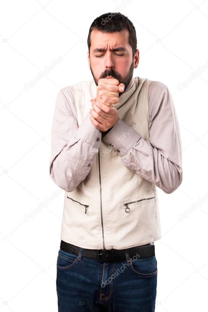 Handsome man with vest coughing a lot on isolated white background