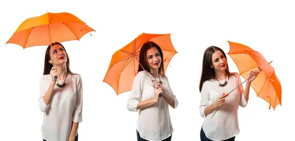 Hezká mladá dívka držící deštník — Stock fotografie