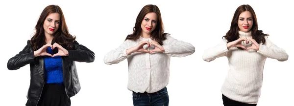 Set of Beautiful young girl making a heart with her hands — Stock Photo, Image