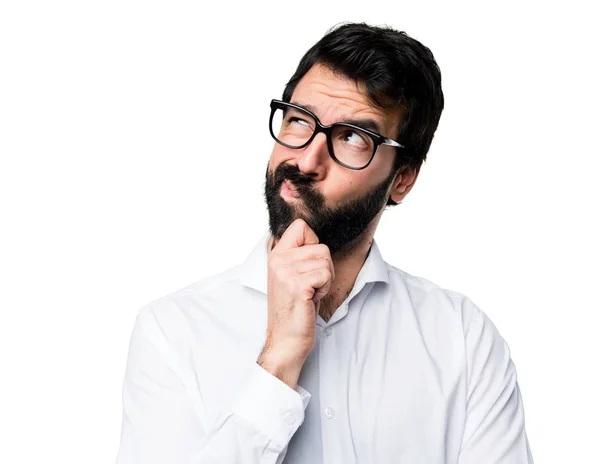 Hombre guapo con gafas pensando — Foto de Stock