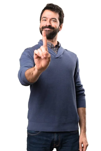 Handsome brunette man with beard counting one on white background — Stock Photo, Image