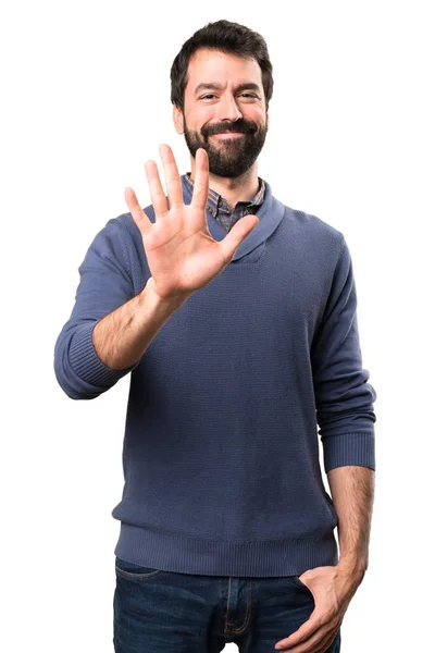 Handsome brunette man with beard counting five on white background — Stock Photo, Image