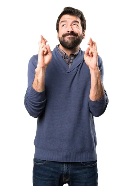 Bel homme brune avec barbe avec les doigts croisés sur fond blanc — Photo