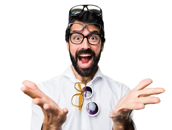 Handsome man with glasses making surprise gesture Stock Picture